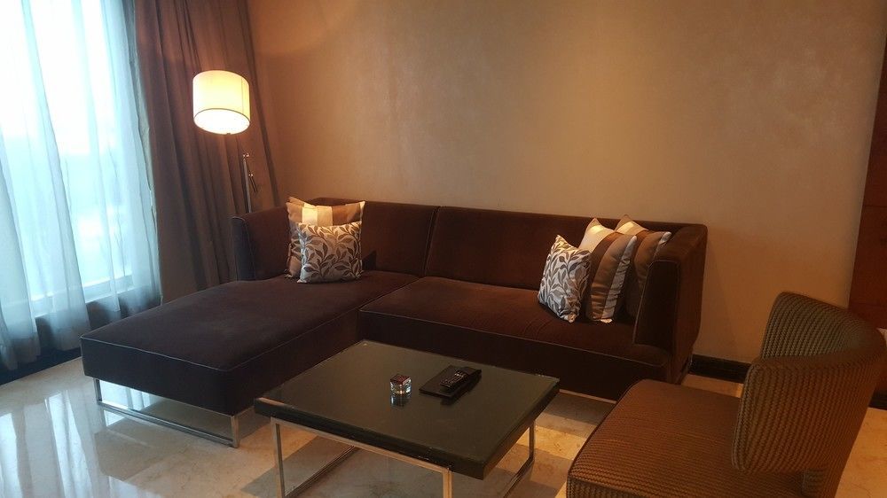 Vivanta Hyderabad, Begumpet Extérieur photo A living room in a suite at the Ritz-Carlton, Kuala Lumpur